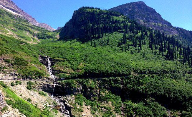 Waterfall dripping off the side of a mountain